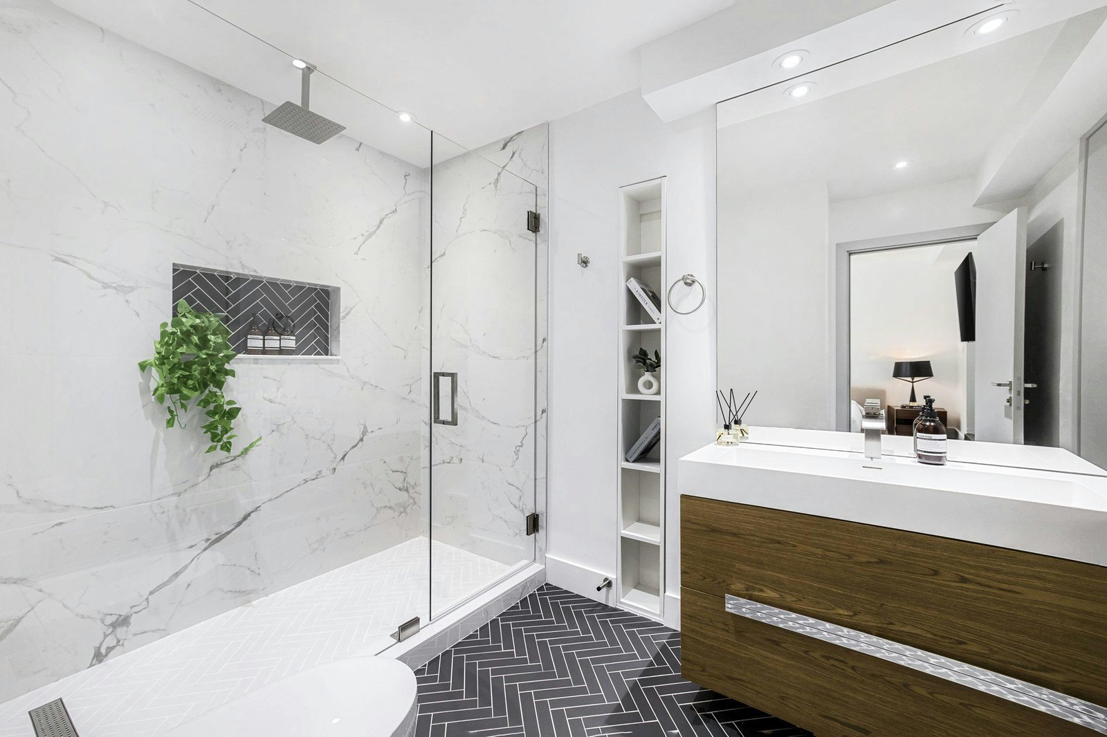 Modern bathroom with glass shower panel and contemporary tile